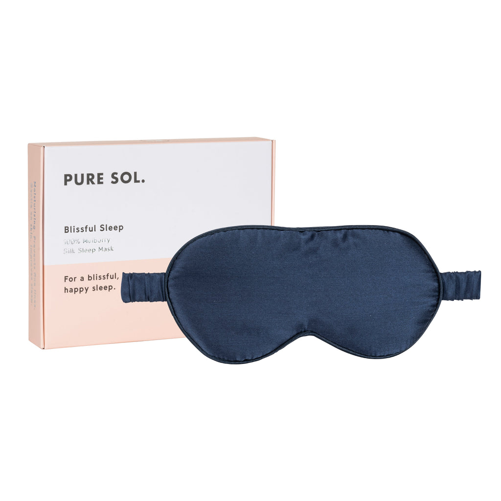 Navy mulberry silk sleep mask with its gift box on a white background